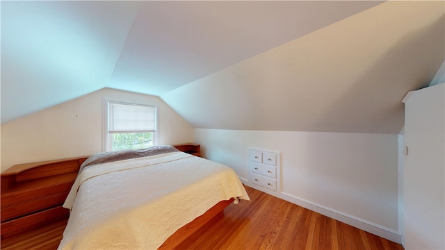 15 Franconia Dr, Cranston, RI 02920 - bedroom with light wood-style floors, lofted ceiling, and baseboards
