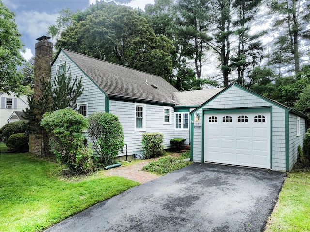 15 Franconia Dr, Cranston, RI 02920 - ranch-style home with driveway, a chimney, roof with shingles, and a front yard