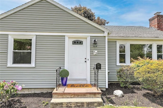 23 Robert Cir, Cranston, RI 02905 - doorway to property featuring a chimney and a shingled roof