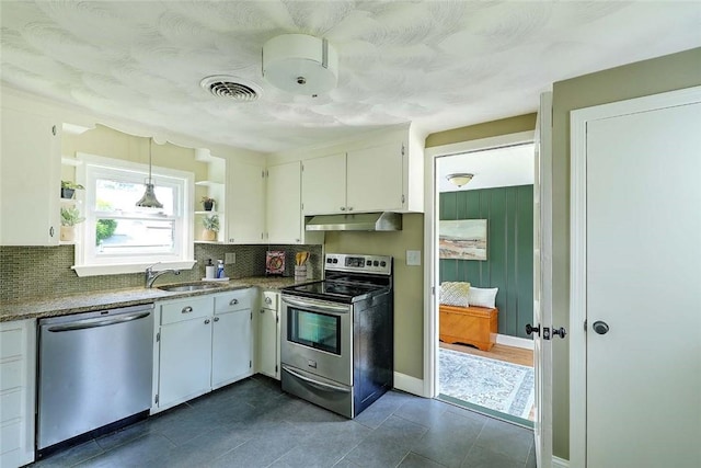 23 Robert Cir, Cranston, RI 02905 - kitchen featuring stainless steel appliances, open shelves, tasteful backsplash, and under cabinet range hood