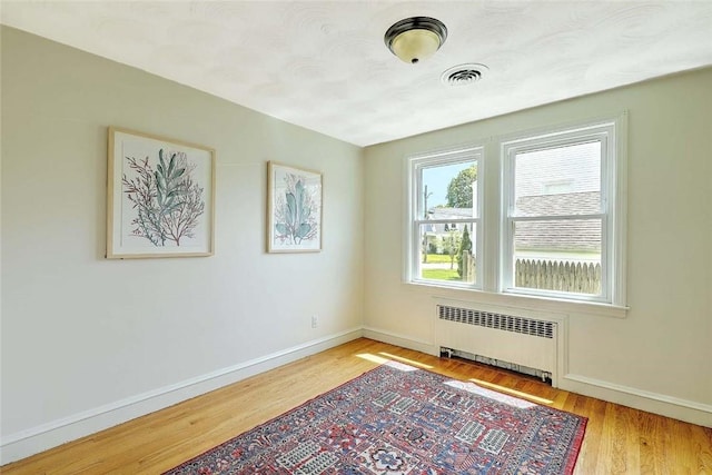 23 Robert Cir, Cranston, RI 02905 - unfurnished room with radiator, baseboards, and wood finished floors