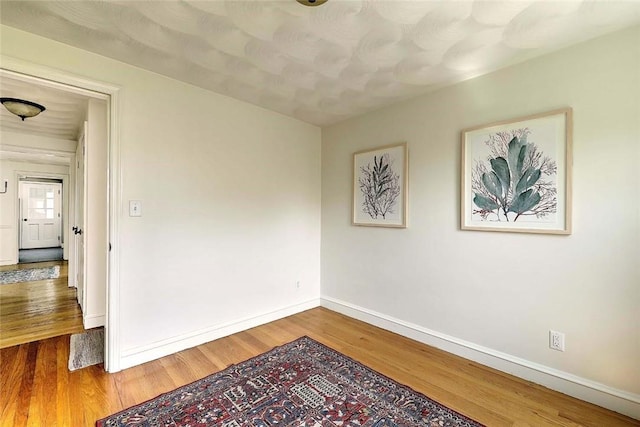 23 Robert Cir, Cranston, RI 02905 - empty room featuring wood finished floors and baseboards