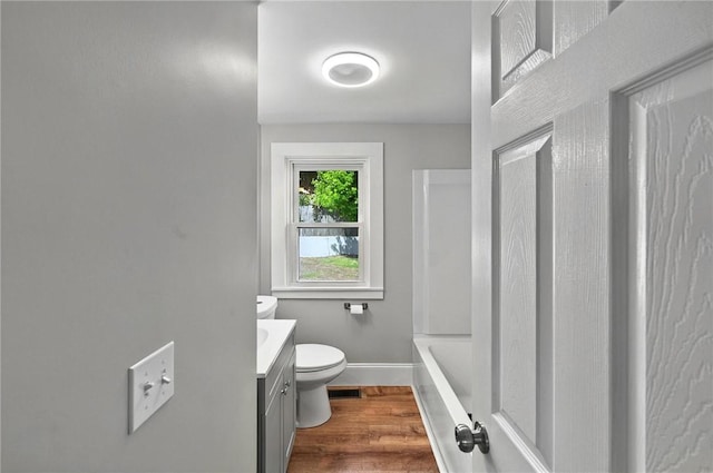 111 Cleveland St, Pawtucket, RI 02860 - bathroom with toilet, vanity, baseboards, and wood finished floors