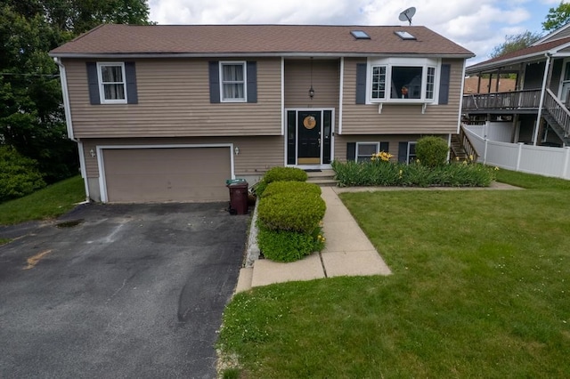 80 Capwell Ave, Woonsocket, RI 02895 - bi-level home with stairs, asphalt driveway, and a garage