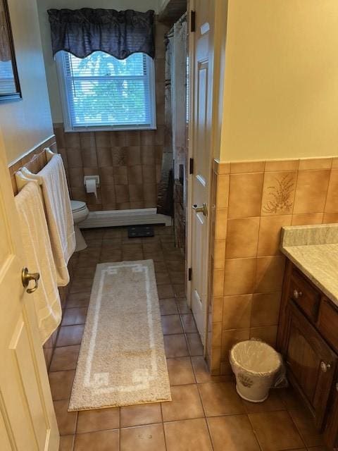 80 Capwell Ave, Woonsocket, RI 02895 - full bath featuring tile walls, tile patterned flooring, toilet, vanity, and a shower with curtain