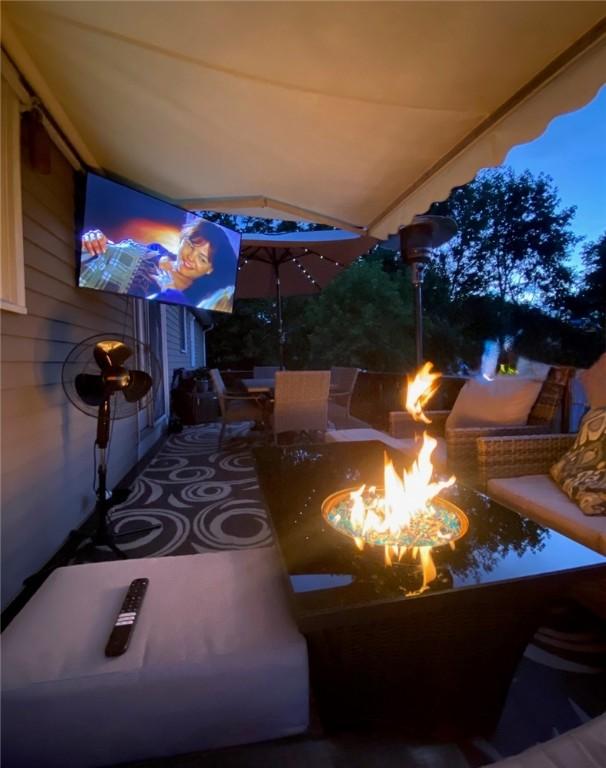 80 Capwell Ave, Woonsocket, RI 02895 - view of patio / terrace with a fire pit