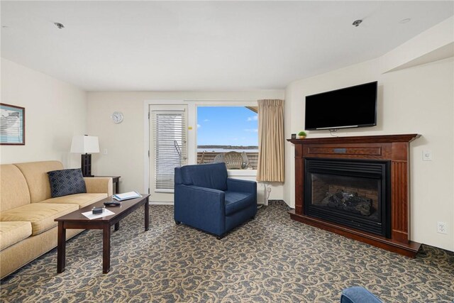 65 Ridge Rd Unit T11/W38, Newport, RI 02840 - carpeted living area featuring a glass covered fireplace