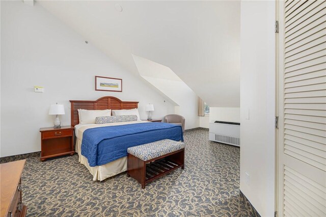 65 Ridge Rd Unit T11/W38, Newport, RI 02840 - carpeted bedroom featuring lofted ceiling and radiator heating unit