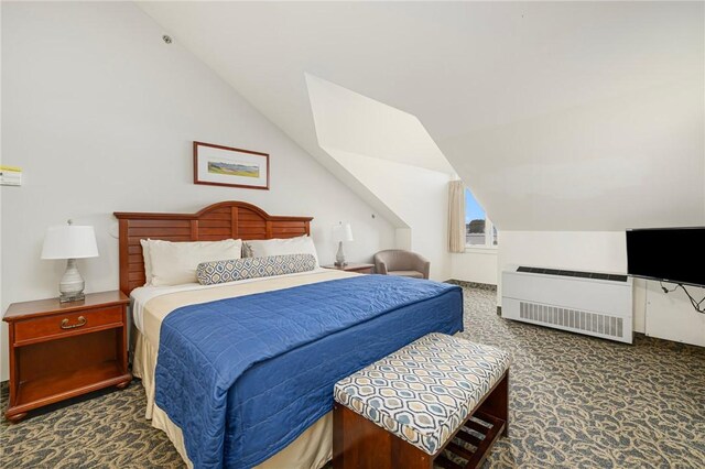 65 Ridge Rd Unit T11/W38, Newport, RI 02840 - carpeted bedroom with radiator and vaulted ceiling