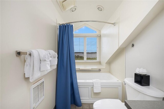 65 Ridge Rd Unit T11/W38, Newport, RI 02840 - bathroom featuring toilet, tile patterned flooring, vanity, and lofted ceiling