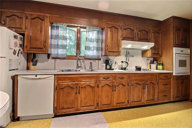 2 Laurel Hill Dr, Westerly, RI 02891 - kitchen with white appliances, a sink, under cabinet range hood, light countertops, and brown cabinetry