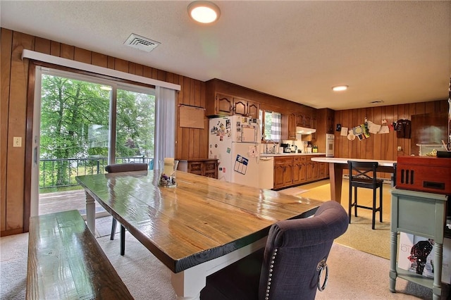2 Laurel Hill Dr, Westerly, RI 02891 - dining area featuring light colored carpet and wood walls