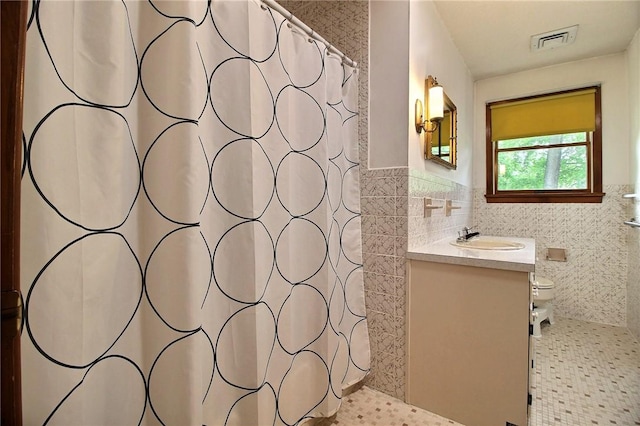 2 Laurel Hill Dr, Westerly, RI 02891 - full bath featuring tile walls, vanity, a shower with curtain, toilet, and a wainscoted wall