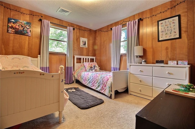 2 Laurel Hill Dr, Westerly, RI 02891 - bedroom featuring carpet, multiple windows, a textured ceiling, and wood walls