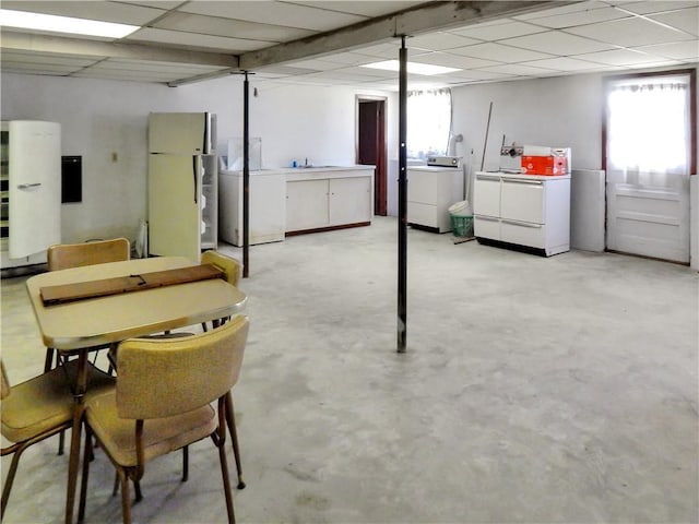 2 Laurel Hill Dr, Westerly, RI 02891 - basement with washing machine and clothes dryer, freestanding refrigerator, healthy amount of natural light, a paneled ceiling, and a sink