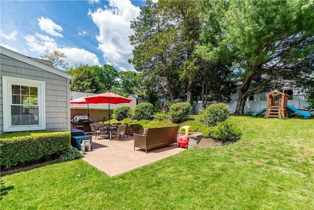 59 Davis Ave, Cranston, RI 02910 - view of grassy yard with a patio area and a playground