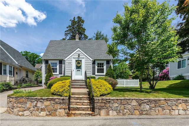 59 Davis Ave, Cranston, RI 02910 - view of front facade with a chimney and a shingled roof