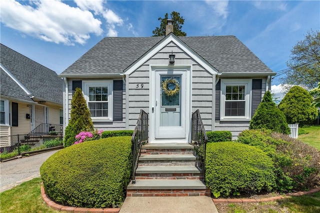 59 Davis Ave, Cranston, RI 02910 - view of front of house featuring a chimney and roof with shingles