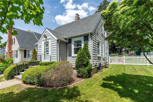 59 Davis Ave, Cranston, RI 02910 - view of front of house with a shingled roof and a chimney