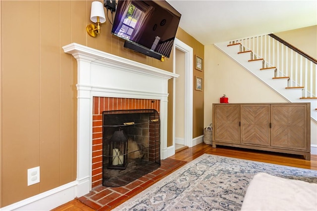 59 Davis Ave, Cranston, RI 02910 - living room with a fireplace, wood finished floors, and stairway