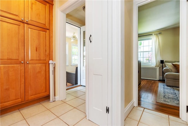 59 Davis Ave, Cranston, RI 02910 - hall featuring radiator heating unit, light tile patterned floors, and baseboards
