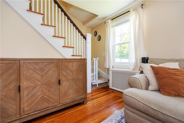59 Davis Ave, Cranston, RI 02910 - interior space with radiator heating unit, light wood finished floors, and stairs