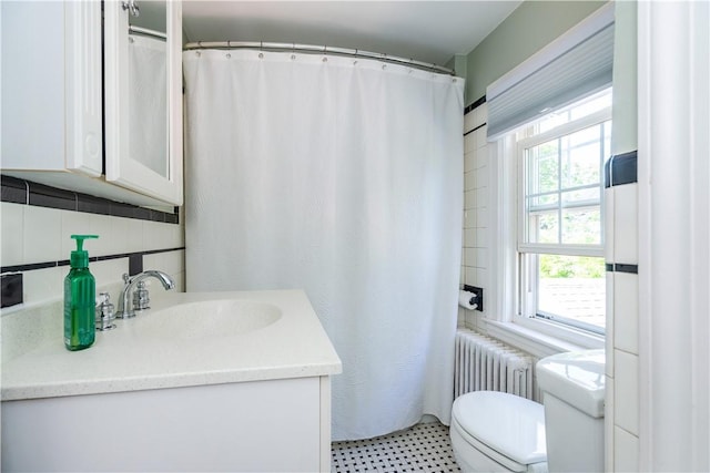 59 Davis Ave, Cranston, RI 02910 - bathroom featuring vanity, radiator, toilet, tasteful backsplash, and a shower with shower curtain