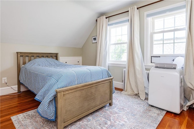 59 Davis Ave, Cranston, RI 02910 - bedroom featuring wood finished floors, lofted ceiling, and washing machine and dryer