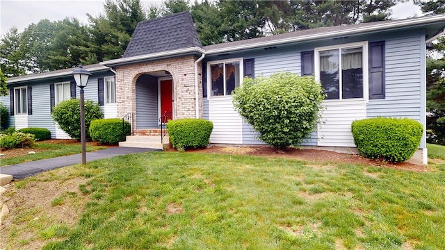 127 Pleasant View Ave Unit 34, Smithfield, RI 02917 - view of front facade with a front yard, stone siding, and a shingled roof