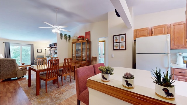 127 Pleasant View Ave Unit 34, Smithfield, RI 02917 - dining area with light wood-type flooring, vaulted ceiling, and ceiling fan