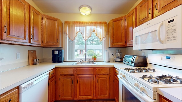 127 Pleasant View Ave Unit 34, Smithfield, RI 02917 - kitchen with white appliances, light countertops, and brown cabinetry