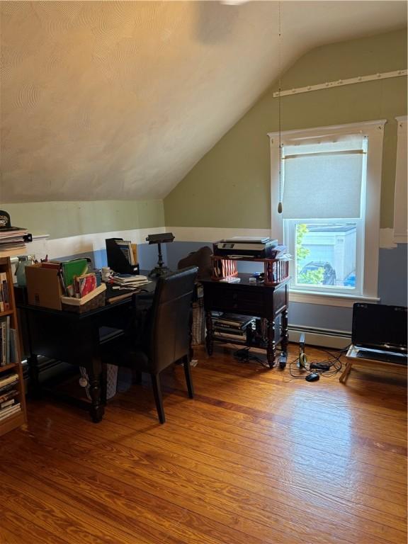 15 Villa Ave, Cranston, RI 02905 - home office with wood finished floors, lofted ceiling, and a baseboard radiator