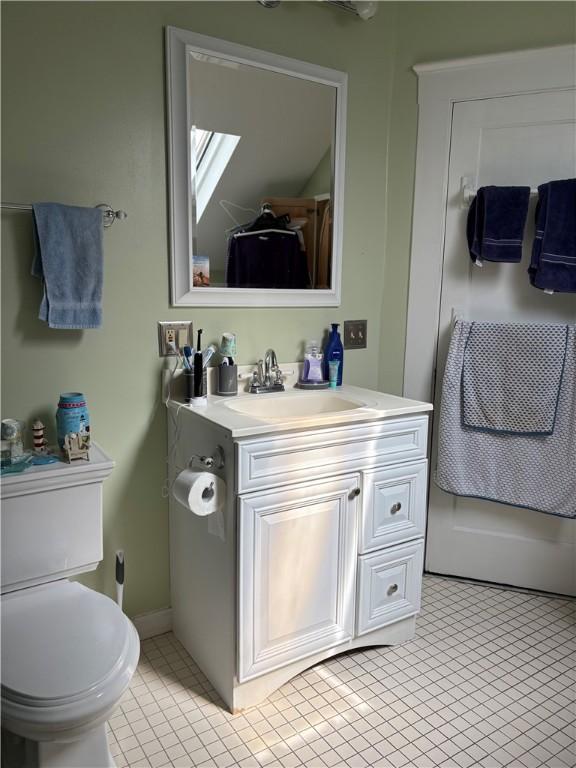 15 Villa Ave, Cranston, RI 02905 - bathroom with vanity, toilet, and tile patterned flooring
