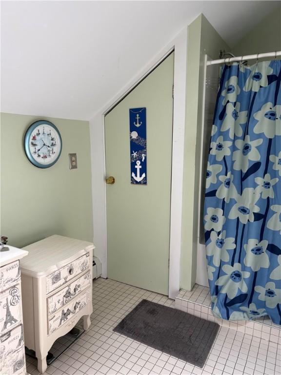 15 Villa Ave, Cranston, RI 02905 - bathroom with curtained shower and tile patterned flooring