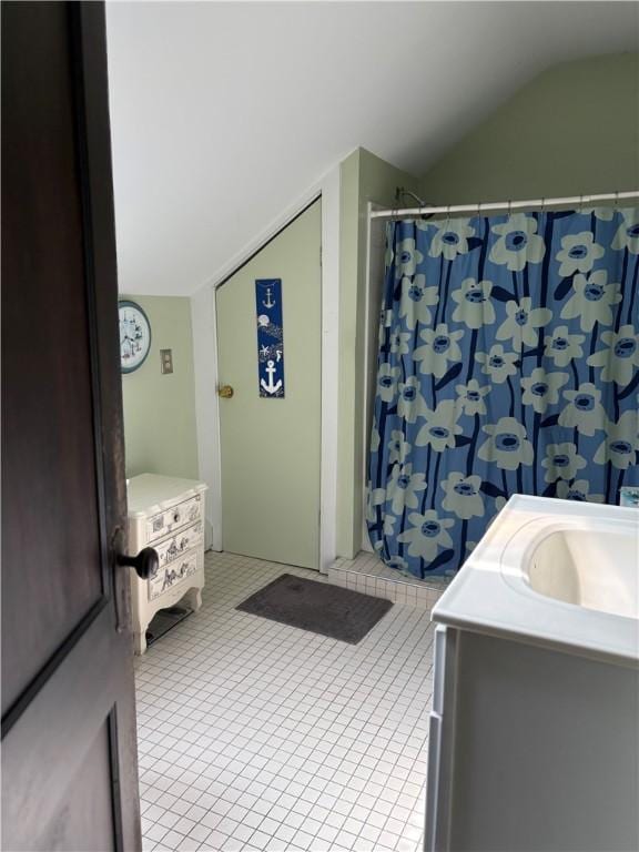 15 Villa Ave, Cranston, RI 02905 - bathroom with vaulted ceiling, vanity, a shower with shower curtain, and tile patterned flooring