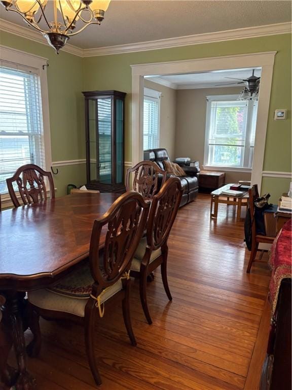 15 Villa Ave, Cranston, RI 02905 - dining room with a chandelier, plenty of natural light, wood finished floors, and ornamental molding
