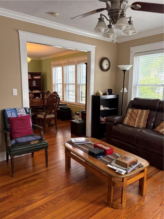 15 Villa Ave, Cranston, RI 02905 - living area featuring a ceiling fan, wood finished floors, and ornamental molding