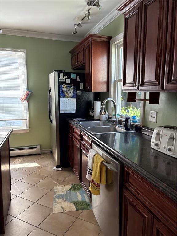 15 Villa Ave, Cranston, RI 02905 - kitchen featuring a baseboard radiator, stainless steel appliances, a sink, crown molding, and light tile patterned floors