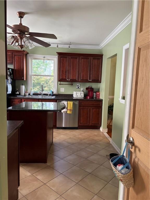 15 Villa Ave, Cranston, RI 02905 - kitchen with dishwasher, a sink, light tile patterned floors, dark countertops, and ornamental molding