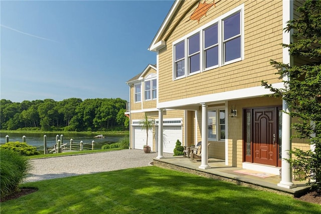137 Congdon Ave, North Kingstown, RI 02852 - exterior space featuring a water view, driveway, a garage, a yard, and a porch