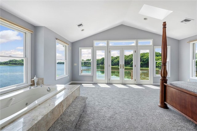 137 Congdon Ave, North Kingstown, RI 02852 - full bathroom with a skylight, vaulted ceiling, a water view, and a tub with jets