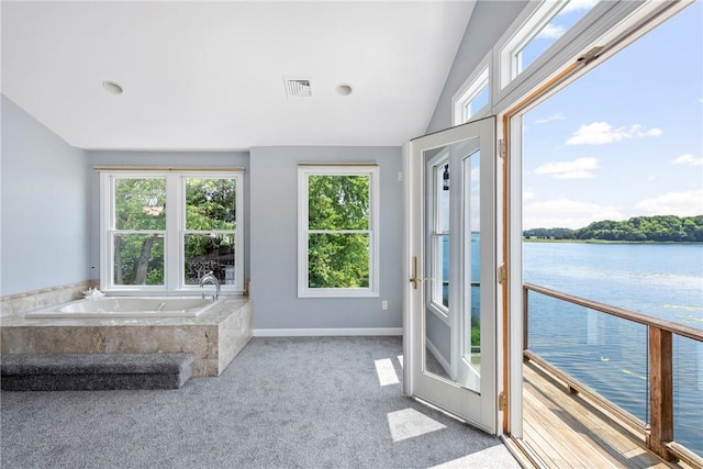 137 Congdon Ave, North Kingstown, RI 02852 - unfurnished sunroom with healthy amount of natural light, a water view, and vaulted ceiling