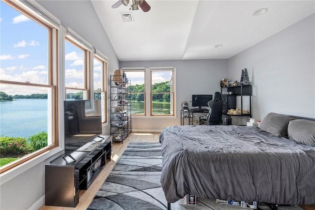137 Congdon Ave, North Kingstown, RI 02852 - bedroom featuring wood finished floors, multiple windows, and lofted ceiling