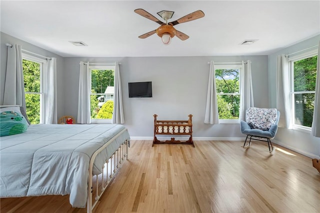137 Congdon Ave, North Kingstown, RI 02852 - bedroom featuring multiple windows and light wood-type flooring