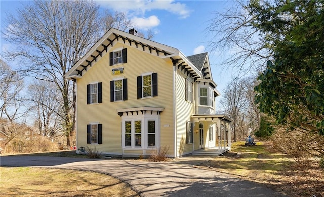 81 Old N Rd, South Kingstown, RI 02881 - view of front facade featuring driveway and a chimney