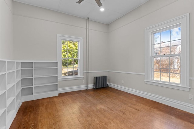 81 Old N Rd, South Kingstown, RI 02881 - empty room with radiator heating unit, hardwood / wood-style floors, ceiling fan, baseboards, and recessed lighting
