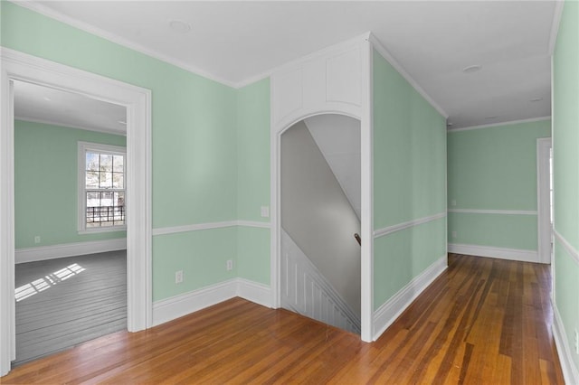 81 Old N Rd, South Kingstown, RI 02881 - unfurnished room with wood finished floors, baseboards, and ornamental molding