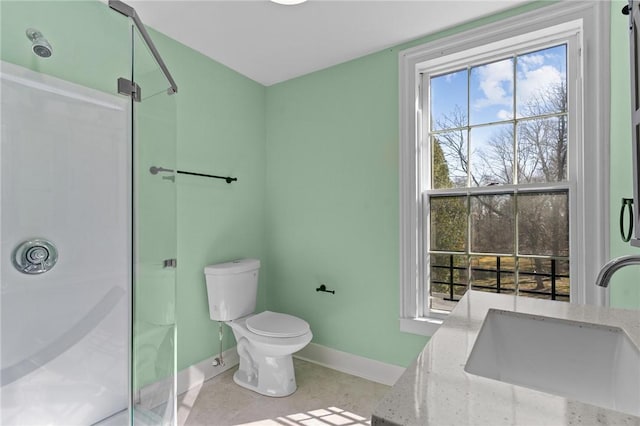 81 Old N Rd, South Kingstown, RI 02881 - bathroom featuring baseboards, a shower, toilet, vanity, and tile patterned floors