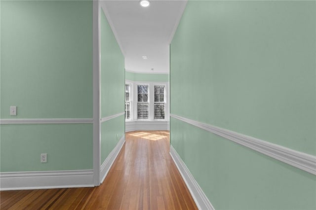 81 Old N Rd, South Kingstown, RI 02881 - corridor with baseboards, wood-type flooring, and crown molding