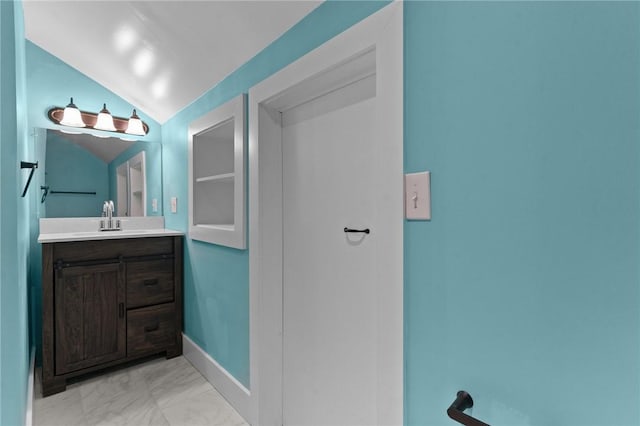 81 Old N Rd, South Kingstown, RI 02881 - bathroom with marble finish flooring, vaulted ceiling, and vanity